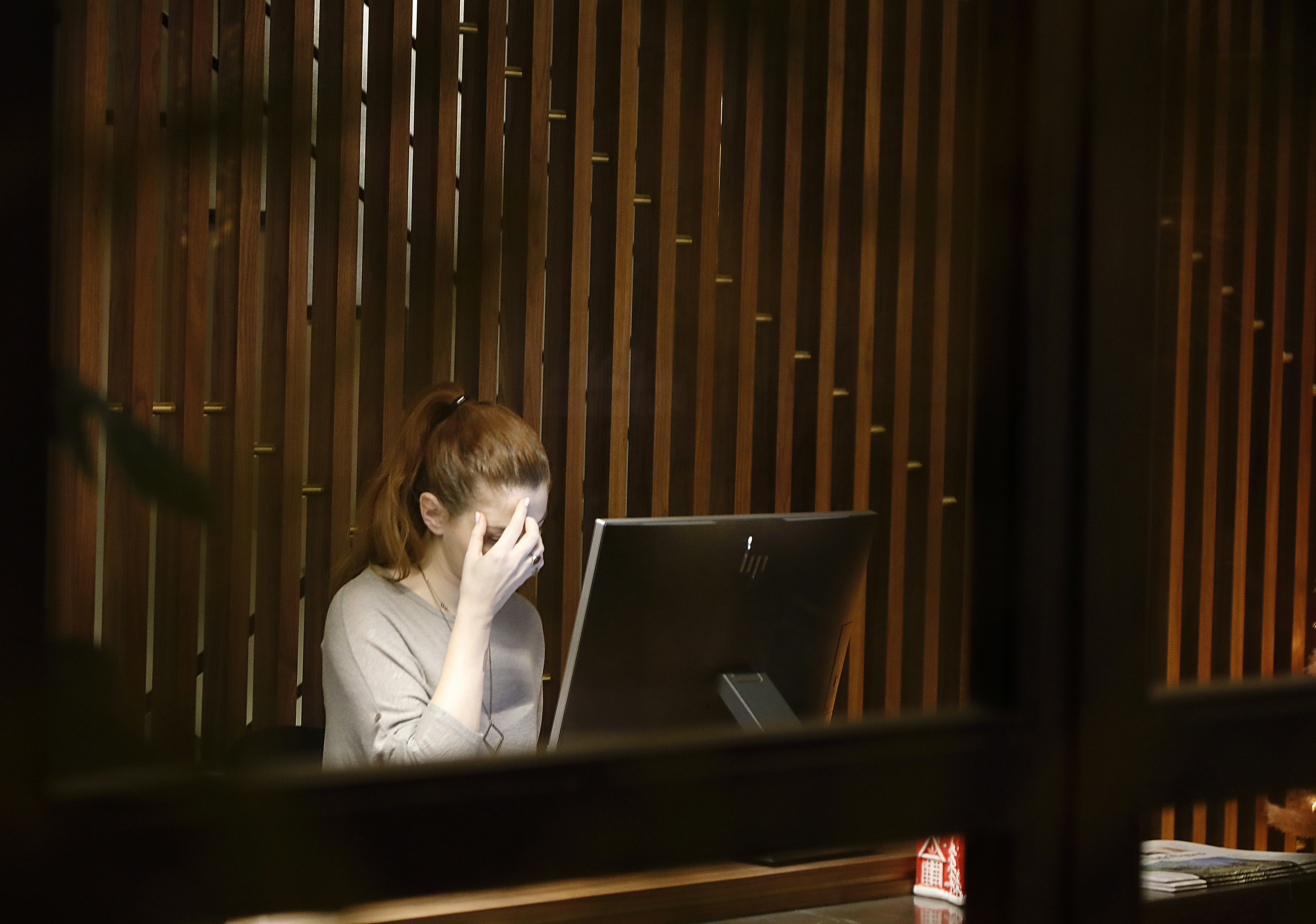 woman sitting in front of computer